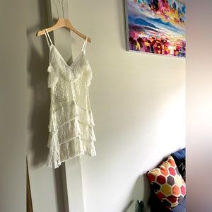 Selling beautiful slightly worn white lace and tassel dress.